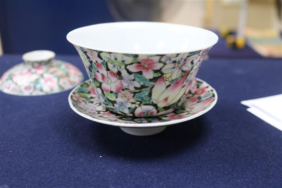 A Chinese ruby ground famille rose dish, early 20th century and a rice bowl, cover and stand